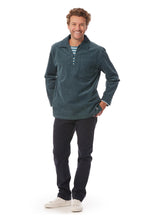 Load image into Gallery viewer, The Cachouroy is a fine corduroy version of the  traditional Breton Fisherman&#39;s smock. Shown here in a petrol blue colour. The top has a v neck and collar with a single fastening and two inside breast pockets.
